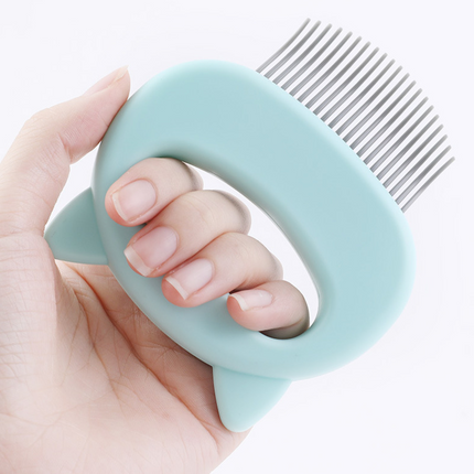 Close-up of cat grooming comb teeth gliding through cat fur for smooth coat