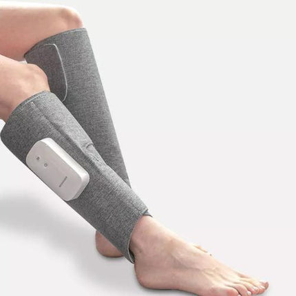 Heating leg massager worn on leg showing compression fit and coverage