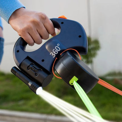 Retractable dog leash with light in use during evening outdoor walk