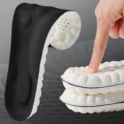 Person inserting shock absorbing insoles into everyday shoes for all-day foot support